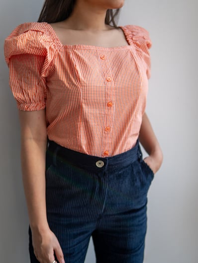 Orange Checkered Square Neck Puff Short Sleeve Top by Gorur Ghash. Fabric: Cotton. Price: ৳1000. Made in Bangladesh (BD). Buy the tops now!