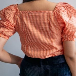 Orange Checkered Square Neck Puff Short Sleeve Top by Gorur Ghash. Fabric: Cotton. Price: ৳1000. Made in Bangladesh (BD). Buy the tops now!